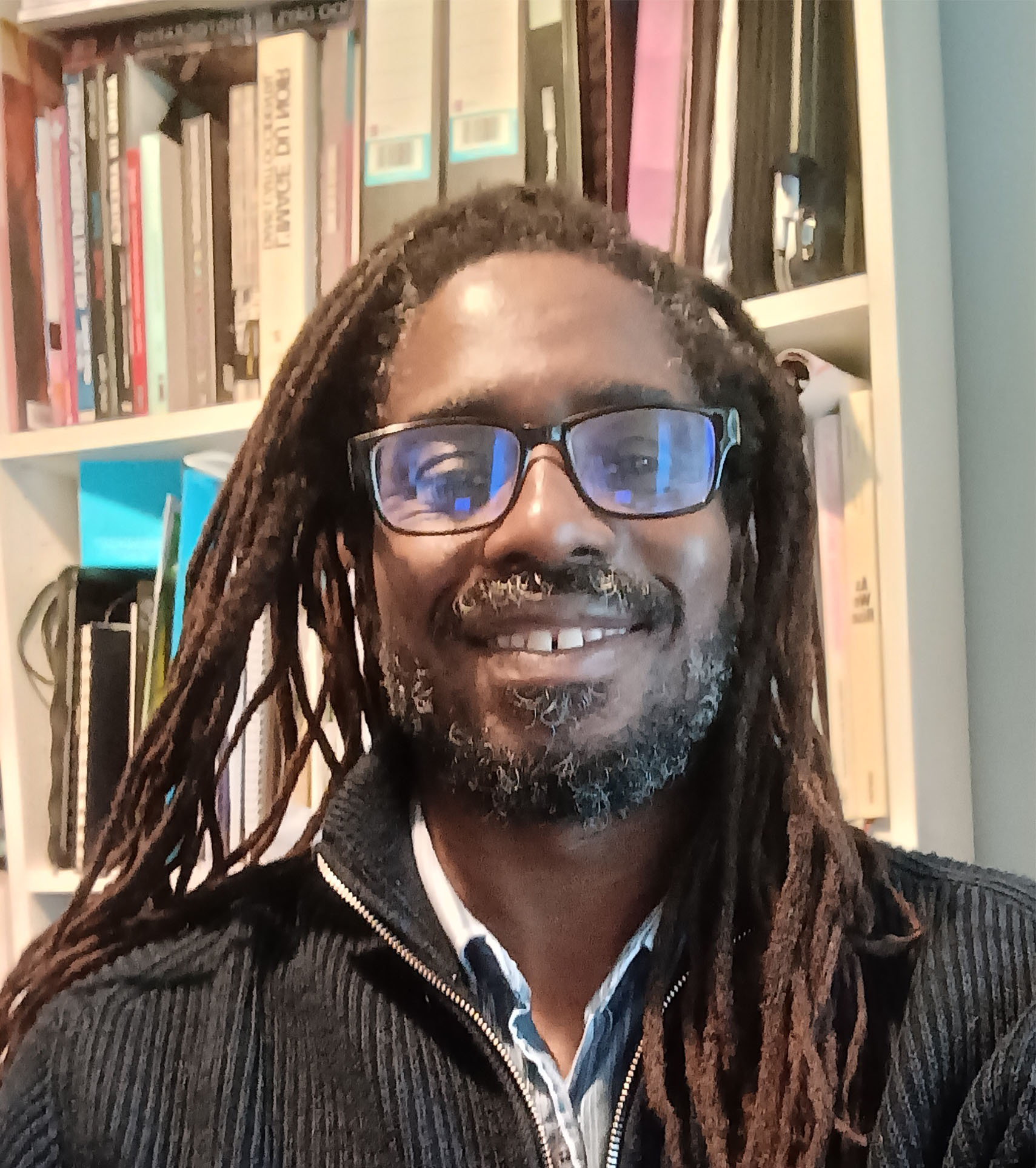 Profile photo of Professor Dr Shawn Hailemariam Sobers with bookcase behind